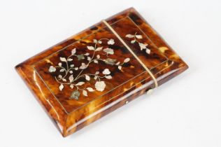 An antique faux tortoiseshell card case with floral mother of pearl inlay, measures approx 10.5cm