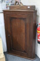 George III Oak and Walnut Hanging Corner Cabinet, the single door opening to three shaped shelves,