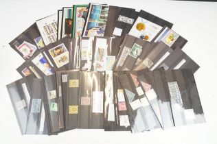 A small collection of British and world stamps mounted in stock cards.