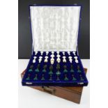 An ornate Indian style chess set within fitted velvet lined case together with a wooden box.