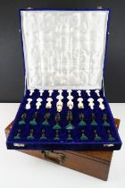 An ornate Indian style chess set within fitted velvet lined case together with a wooden box.