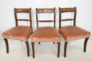 Set of Six Regency Mahogany Dining Chairs with twisted carved central rails, stuff-over seats and