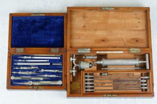 An antique draftsmans set within fitted wooden case together a wooden cased medical set.