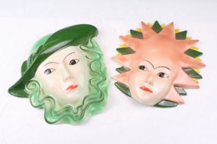 Two Crown Devon pottery wall masks, painted by Dorothy Ann, measure approx 24.5cm high