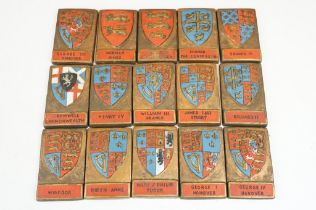 A collection of composite moulded coats of arms / shields.