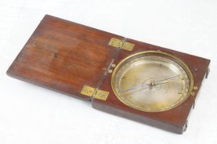 An antique wooden case compass marked Pattingham to the dial.