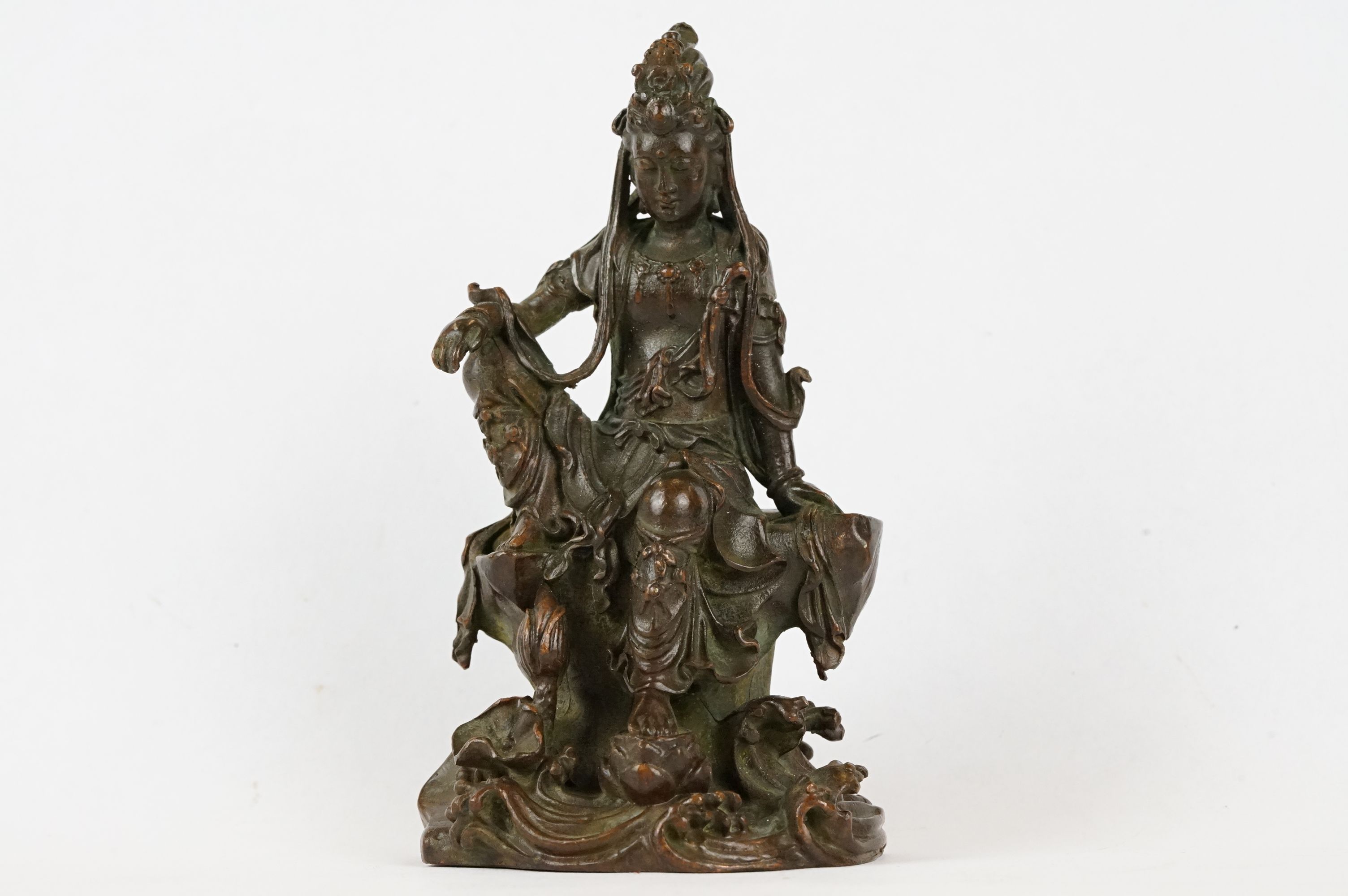 An oriental bronze figure of Guanyin, stands approx 10cm in height.