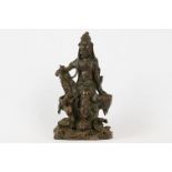 An oriental bronze figure of Guanyin, stands approx 10cm in height.