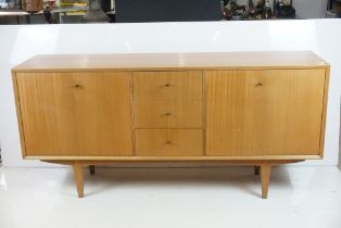 Mid century Vanson Teak Sideboard with a central bank of three drawers, the top drawer fitted with