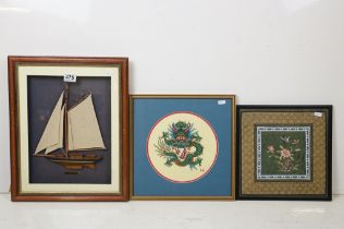 Model boat in a frame, name plaque below ' Bella Green ', 47 x 38cm overall, circular needlework