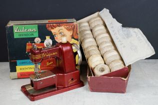 Vulcan senior child's sewing machine in original box with a selection of thread in original box.