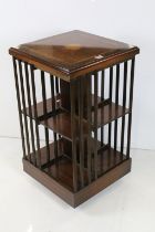 Edwardian Inlaid Mahogany Square Revolving Bookcase raised on castors, 47cm wide x 83cm high