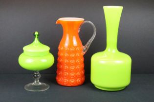 Three pieces of 20th century coloured glass to include a green vase of bulbous form, green glass