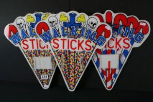 Three fairground style 'Walking Sticks' wall hanging signs, approx 40cm long