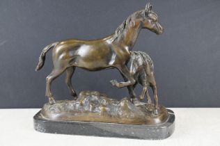 Bronze figure group of a horse and foal, raised on a rectangular marble base. Approx 24cm wide