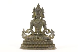 Buddhist bronze figure of Guan Yin in a seated pose