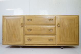 Ercol Pale Elm Windsor 455 Sideboard with central bank of three drawers flanked either side by