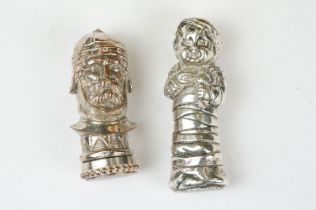 A pair of silver plated figural vesta cases.