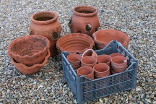 Two Terracotta Strawberry Pots, 33cm high together with four circular terracotta garden pots and a