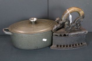 19th Century Victorian cast iron iron having a scrolled griffin handle with oak to the top, together