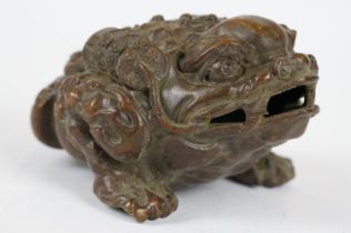 A Chinese bronze figure in the form of Jin Chan also called Chan Chuy.