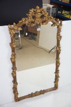 20th century Gilt Framed Wall Mirror with moulded leaf and flower decoration, 123cm x 72cm