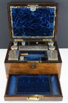 Victorian rosewood vanity box, the fitted interior with various glass jars with silver plated