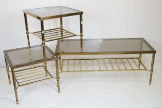 Set of Three Mid century Brass Tables with smoked glass tops and slatted under-shelves, the