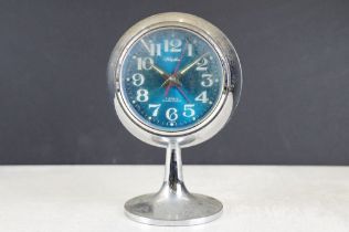 Mid 20th C Retro ' Rhythm ' Japanese alarm clock, the blue dial with Arabic numerals. Measures