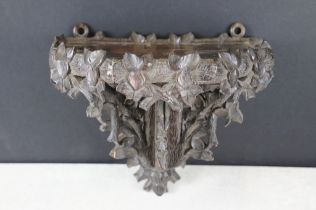 Late 19th century Black Forest carved wooden wall bracket / wall shelf, with intricate foliate