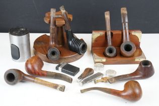 A collection of mixed estate smokers pipes together with a pipe rack