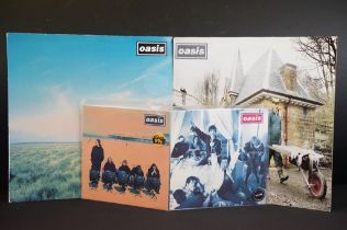Vinyl - two original 12” singles and 2 original 7” singles by Oasis to include: Whatever (UK 1st