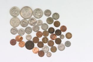 A Small Collection Of United States Of America Coins To Include An 1886 Silver Dollar And An 1852