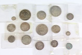 A collection of fourteen British King George III early milled silver coins to include three half