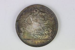 A British pre decimal silver 1887 Queen Victoria full crown coin.