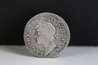 A British King James II silver Maundy four pence coin.