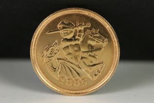 A British Queen Elizabeth II 2005 gold half sovereign coin.