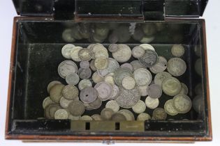 A collection of British pre decimal silver coins contained within a vintage money box to include