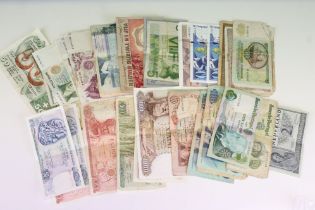 A collection of mixed world circulated and uncirculated banknotes to include German, French, Italian
