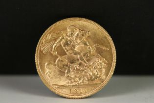 A British King George V 1911 gold full sovereign coin.