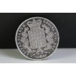 A British Queen Victoria 1844 (Young Head) silver full crown coin.