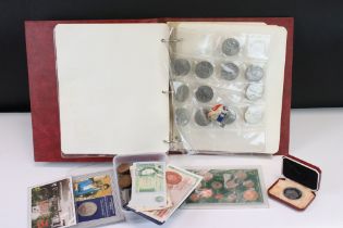 A collection of mainly British coins and banknotes to include commemorative and silver examples.