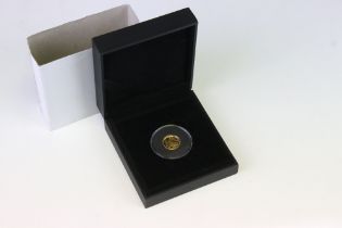 A Queen Elizabeth II 2014 fine gold 1/10 oz Angel coin, encapsulated and within fitted display case.