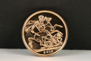 A British Queen Elizabeth II 2013 gold full sovereign coin.