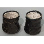 Clare CLEMO (20th Century) Two earthernware black glazed Unomi, signed on labels to base, 3.5"