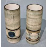 ƚ Troika Pottery, Two cylinder vases with geometric design, each signed to base, 5.75" hgih (