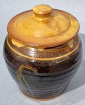 ƚ Clive BOWEN (British b. 1943) An earthenware oviform and domed lid store jar, honey and