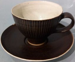 ƚ Lucie RIE (Austrian 1902-1995) Cup and saucer, Porcelain, monogram to base, 2.75" (cup height) (