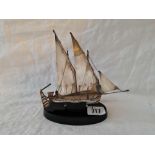 A two masted sailing boat on plinth, 6" high, import mark