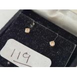 A boxed pair of gold diamond earrings 14ct gold